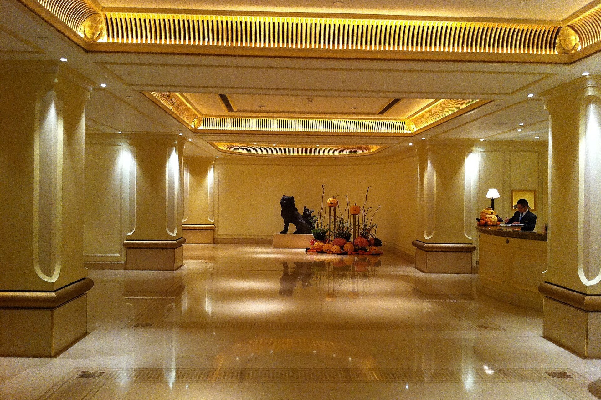 The grand lobby of a landmark Asian hotel at close of day